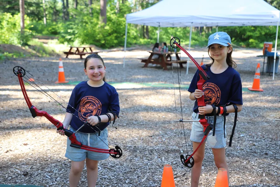 Campers at archery with bows